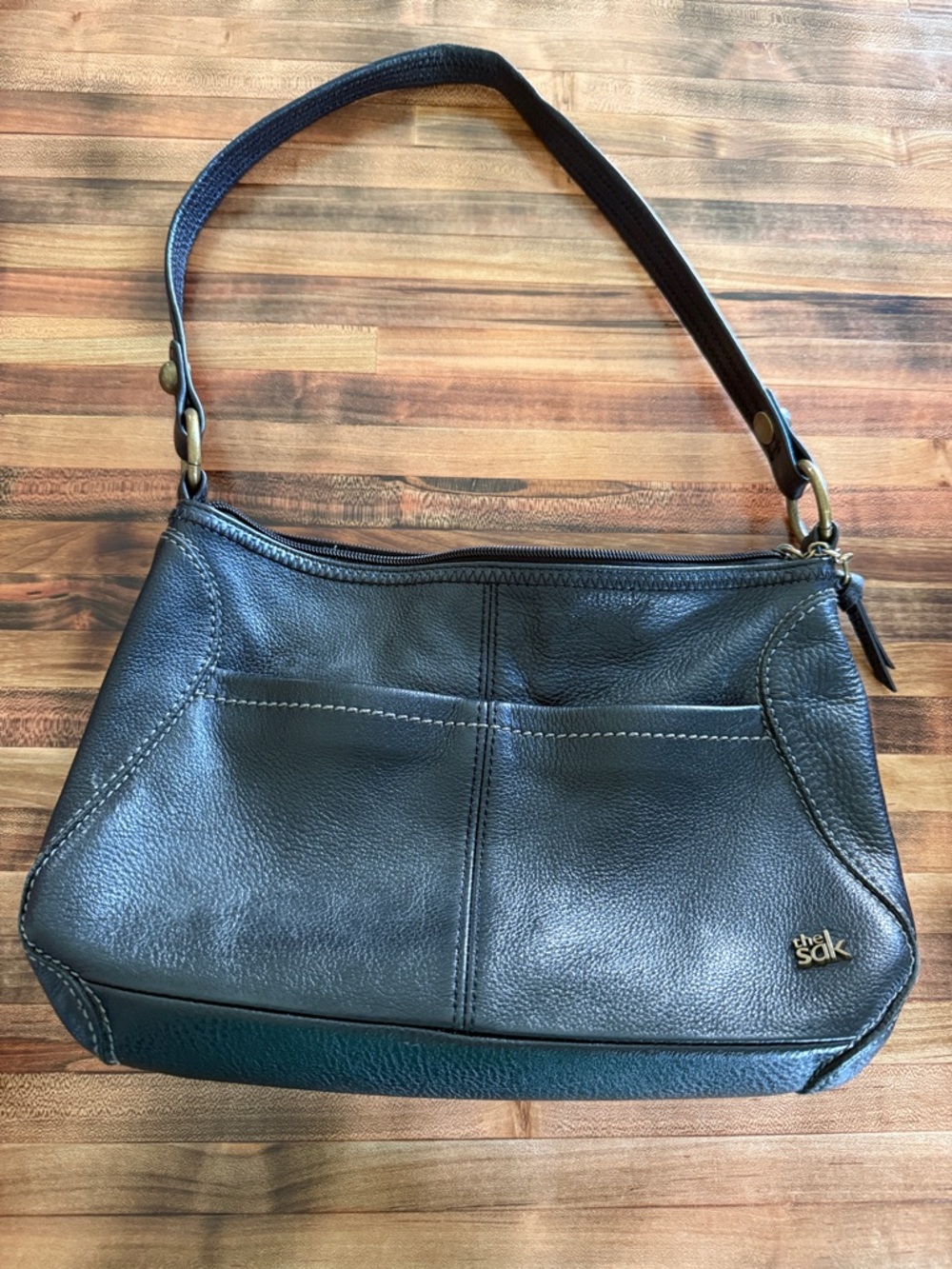 The Sak Black Leather Shoulder Bag with Gold Logo